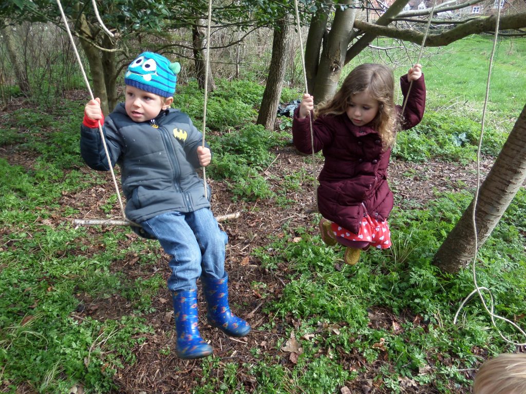 On a swing in the forest school